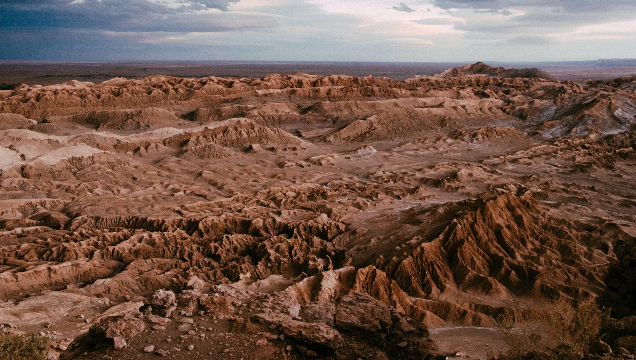 Valle de la Luna rock formations in the Atacama Desert at sunset